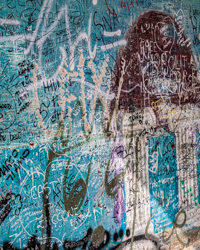 Vivid turquoise harmonizes the mural marks of this abstract composition.