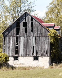 This Door County, WI, barn tolerates its graying boards and drafty holes.