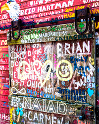 An old fishing shed door finds new life with the vibrancy of graffiti.
