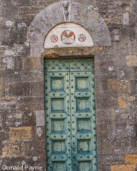 In this massive Volterra stone wall, a small, somewhat forboding door admits only the most stalwart.
