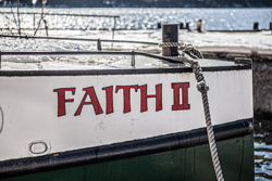 Moored and patient, Faith II waits for its human cargo.